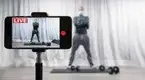 ess-Trainer-Live-Streaming-A-Workout-On-His-Iphone.webp