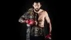 hter-Ryan-Bader-Holding-The-Bellator-Champion-Belt.webp