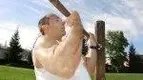 Man-Doing-Underhanded-Pullup-Outdoors.webp