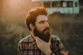 hipster-man-stroking-his-beard-1024x681.webp