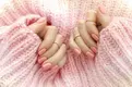 Hands-with-pink-manicure.webp