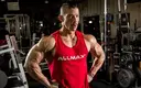 allmax-athlete-with-shoulder-pump.webp