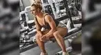 nne-Marshall-sitting-on-a-barbell-bench-in-the-gym.webp