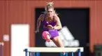 ulter-Alysha-Newman-running-the-hurdles-on-a-track.webp