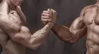 Two-Muscular-Males-Arm-Wrestling-Holding-Hands.webp