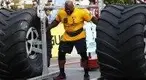 s-on-his-shoulders-at-a-2022-strongman-competition.webp