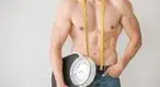 ular-Male-Holding-Scale-Measuring-Tape-Around-Neck.webp