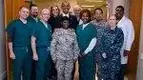 wearing-medical-scrubs-with-former-President-Obama.webp