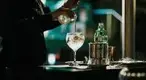 Bartender-and-mixologist-making-a-gin-coctail.webp