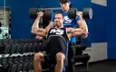 seated-dumbbell-press-with-partner.webp