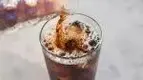 Cold-brew-coffee-being-poured-into-a-cup-of-ice.webp