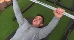 Muscular man making inverted row mistakes- wrong hand position