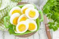 Eggs sitting in basket on dinner table