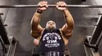 Bodybuilder Juan Morales working out his chest with a close grip barbell bench press exercise