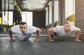 gym partners training in a gym