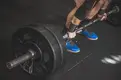 athlete about to deadlift with hands on the bar