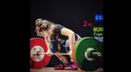 Olympic weightlifter Fraer Morrow performing a clean and jerk at a weightlifting competition