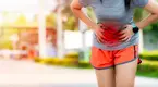 Female runner suffering from period cramps