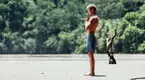 Yoga instructor performing a sun salutation yoga move