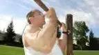 Man Doing Underhanded Pullup Outdoors