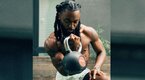 Rapper Olu performing a kettlebell workout