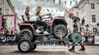 Strongman Adam Roszkowski performing a farmer carry with a farmer tractor at the SCL ESTONIA 2024