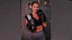 “The Fight Nutritionist” Jackie Kaminski wearing boxing gloves