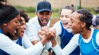 Female college athletes and coach cheering for an upcoming game while hiding unaffected sports related stress