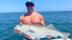 Chris Cuomo with a big fish he caught in a deep sea fishing trip