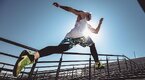 Fit muscular man improving his cardio with a 15 minute outdoor stair workout