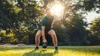 Man doing functional fitness workout in the park with a kettlebell swing exercise