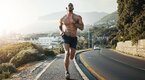 Fit muscular man with six pack abs running on the streat for a steady state cardio workout using the 4 day core workout program