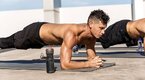 Fit man performing the 4-day core workout outdoors using planks