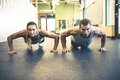 Couple Performing Push Ups