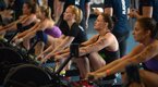 Female Crossfit competitors at the rowing station