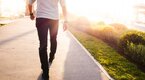 Fashionable man walking on the street during sunrise