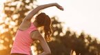 Girl-Stretching-Sunset