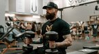 Jake Luhrs holding dumbbells