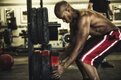 Man Loading Olympic Plates