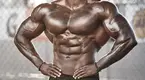 Kyron-Holden-Posing-Showing-Muscular-Chest.webp