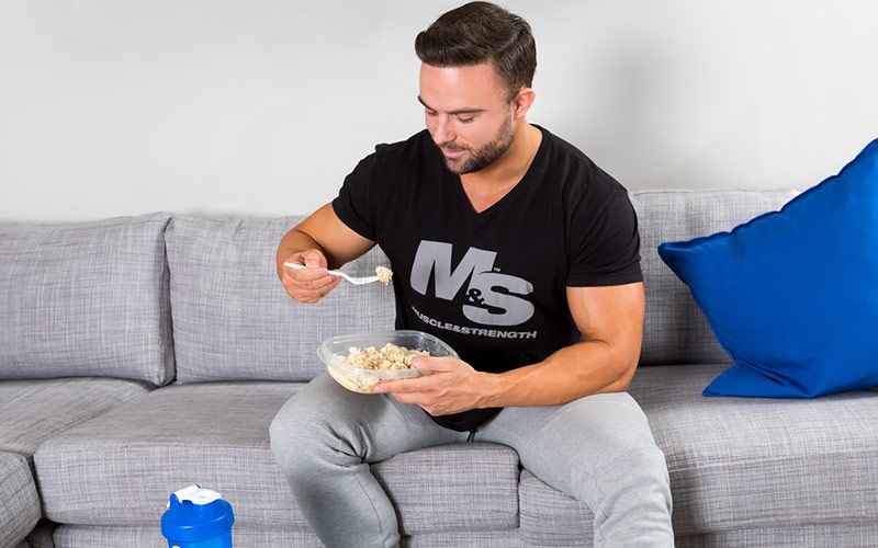 Male Bodybuilder Eating Chicken and Rice