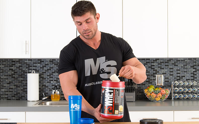 M&S Athlete Taking a scoop of Prosupps Protein