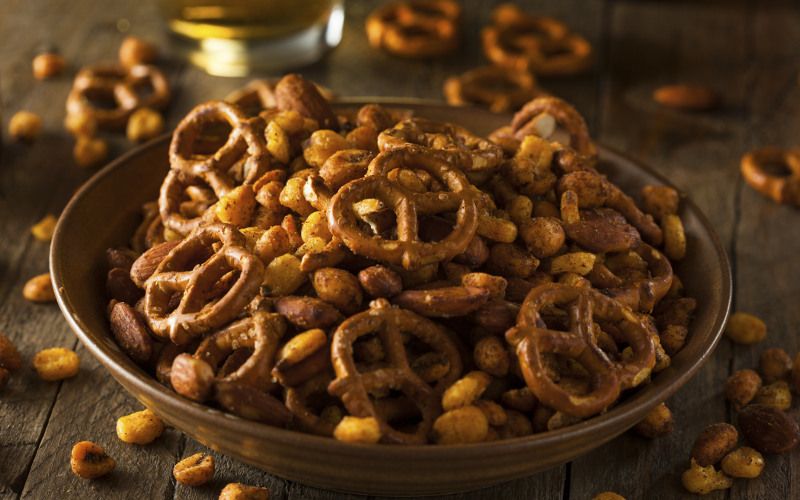 Bowl of salty pretzels and nuts