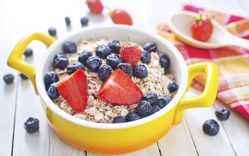 Bowl of oatmeal topped with fresh fruit